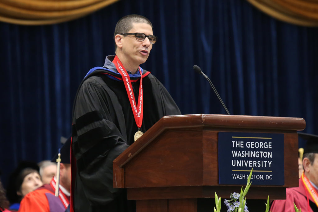 Antonio Lopez, an associate professor of English, addresses graduates at the second ceremony for the Columbian College of the Arts and Sciences Saturday.