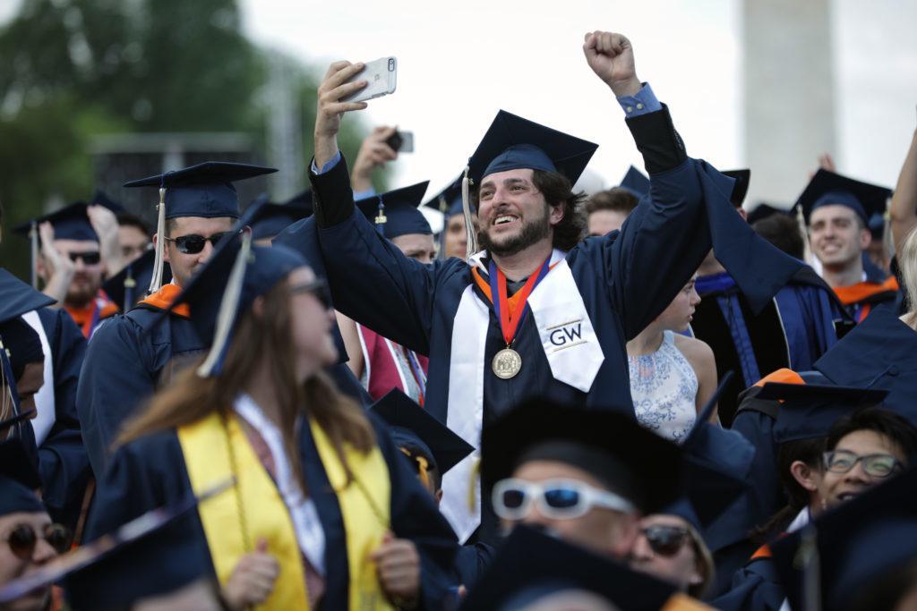 Students cheer during the Universitys commencement ceremony Sunday. 
