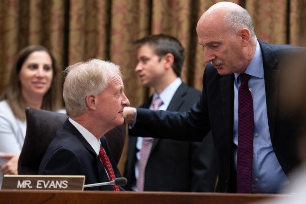Councilmember Jack Evans, left, speaks to Chairman Phil Mendelson at a D.C. Council meeting Tuesday. Evans introduced legislation at the meeting that proposed a plastic straw ban at all District restaurants.