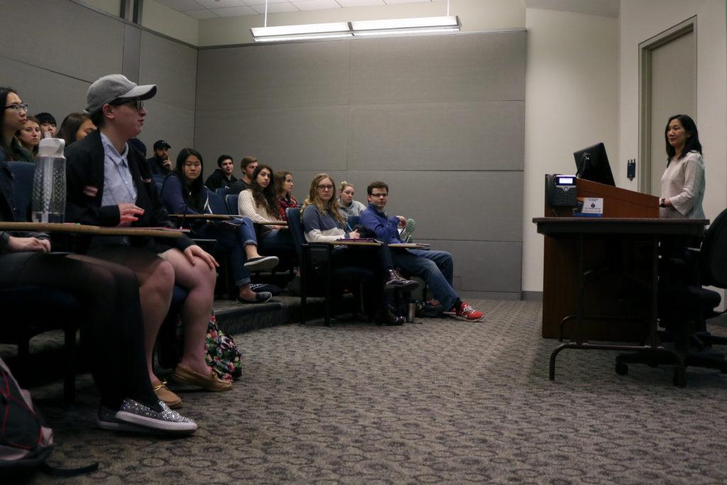 Students listen to a lecture in a classroom in the Elliott School of International Affairs. 