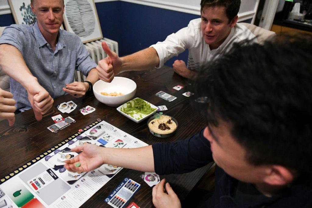 A group plays the board game 