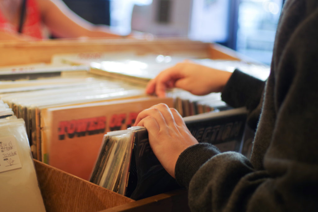 A customer sifts through records at Joint Custody, a thrift and record shop on U Street. 