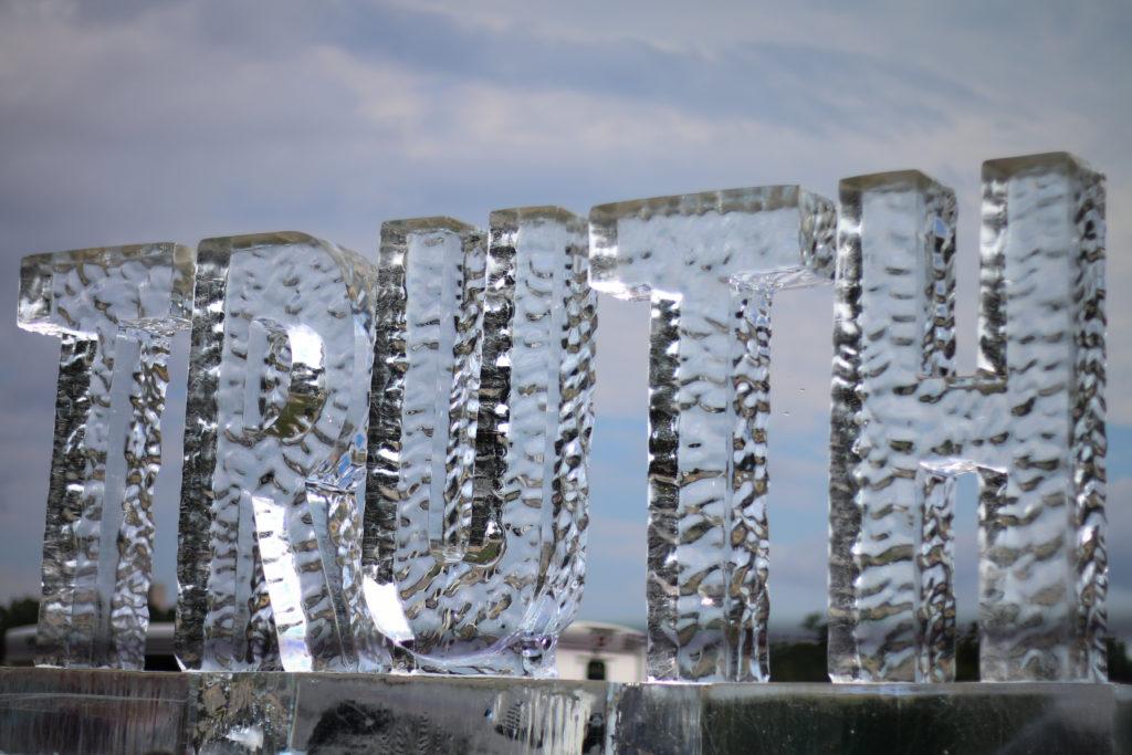 A 2,000-pound ice sculpture that spelled out the word “truth” was stationed on the National Mall Saturday.