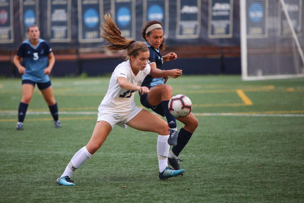 Freshman midfielder Alexandra Flipkowski faces off against a Rhode Island player during a home game last month. 