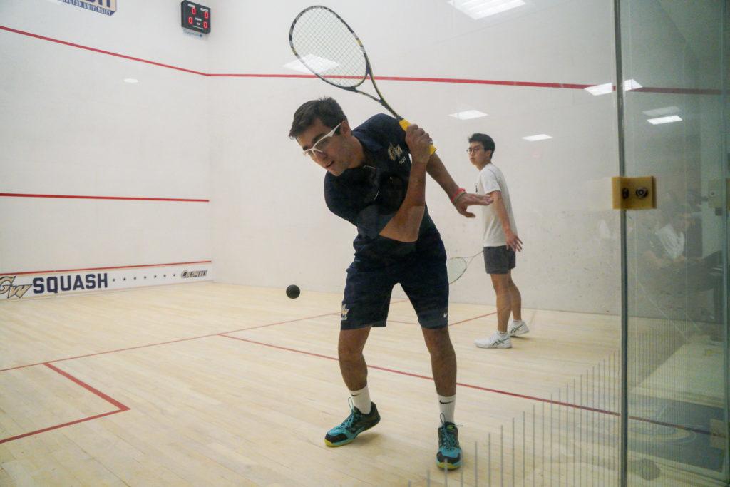 Sophomore+Salim+Khan+swings+at+a+ball+during+a+mens+squash+game+against+Georgetown+last+month.