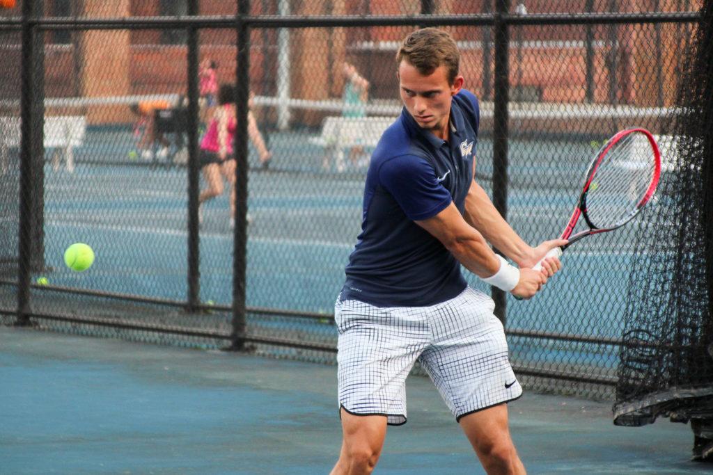 Junior Jakub Behun prepares to return a ball during a mens tennis practice in the fall.