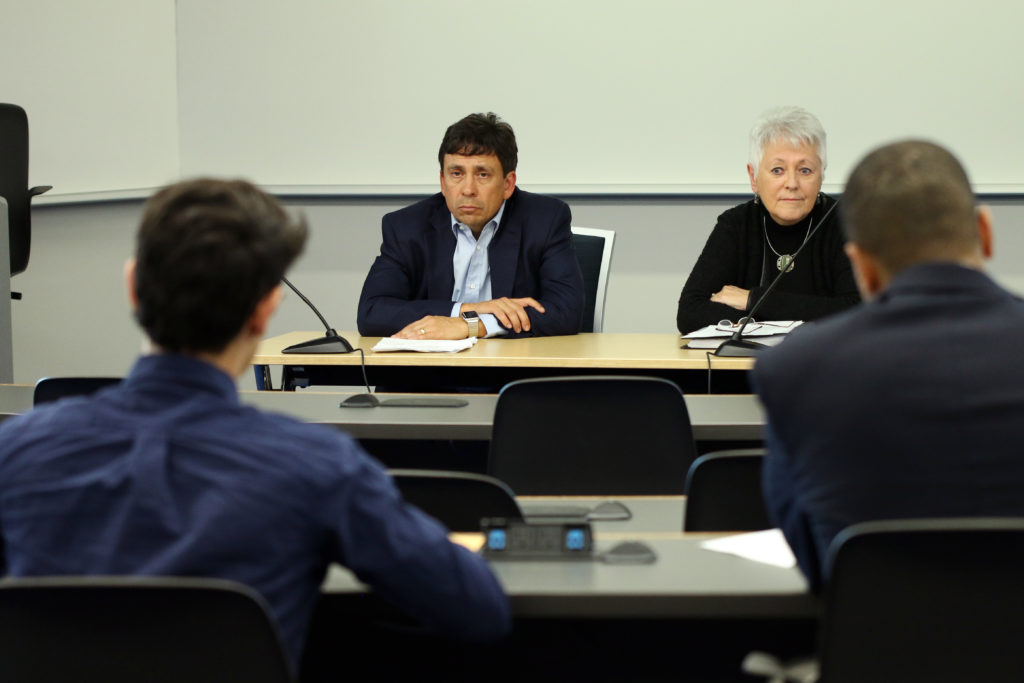 Nelson Carbonell, the chairman of the Board of Trustees, and Sally Mason, an outside consultant heading a community review of University President Thomas LeBlanc, listen as students provide feedback on the president's job performance during a forum Thursday.