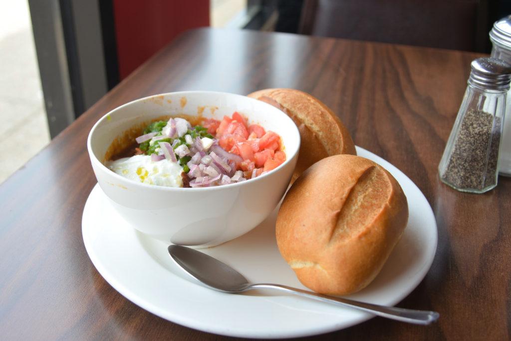 Keren Cafe and Restaurant serves ful, a traditional breakfast dish with mashed fava beans and topped with yogurt.