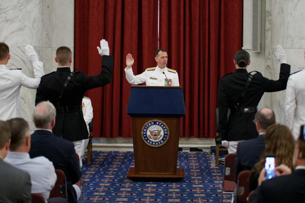 Chief of Naval Operations Admiral John Richardson administers the Uniformed Services Oath of Office to the graduating class of midshipmen from the Capital Battalion, which is based out of GW.