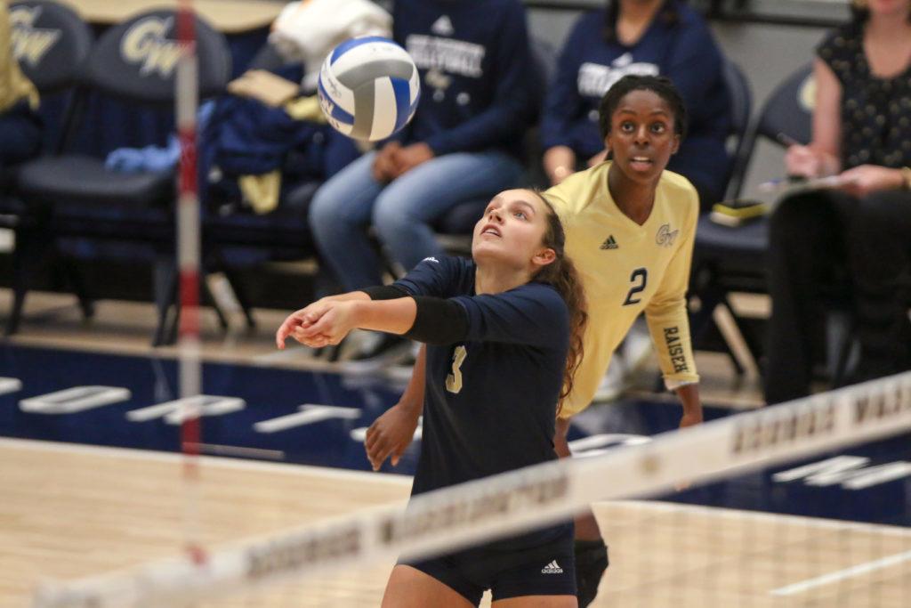 Sophomore Libero Bella Bowman passes the ball during Fridays match against American. In their three game tournament this weekend, the Colonials won a majority beating Howard and Hartford. 