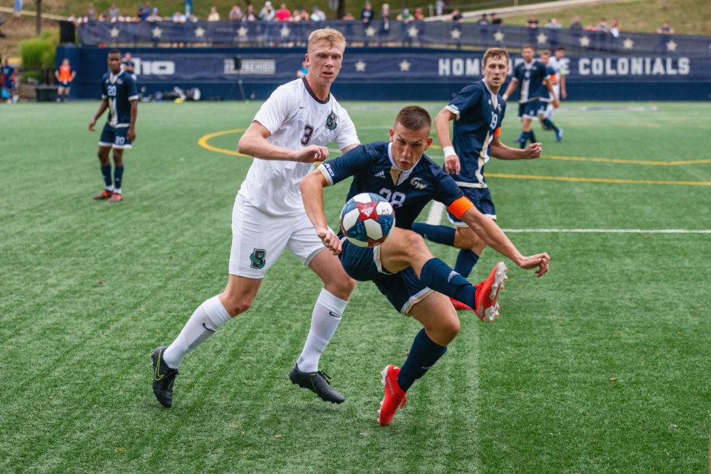 Graduate student defender and midfielder Alexy Boehm kicks the ball during a game in September.
