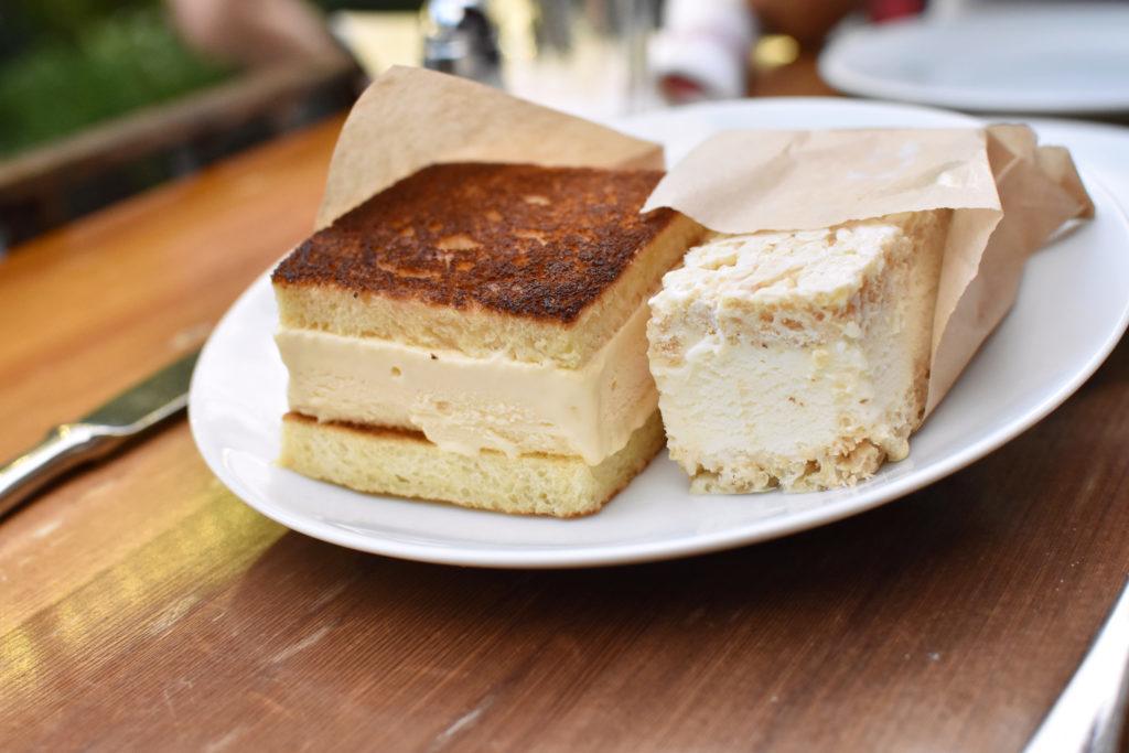 The ice cream dish is presented in sandwich form to mimic the presentation of a standard grilled cheese. 