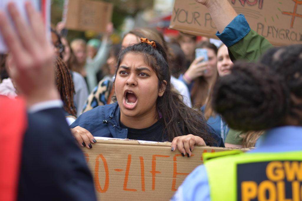 The pro-choice counter-protesters carried cardboard signs with messages like “policing women’s bodies is a sin” and brought a loudspeaker playing songs from artists like Beyoncé and Lizzo.