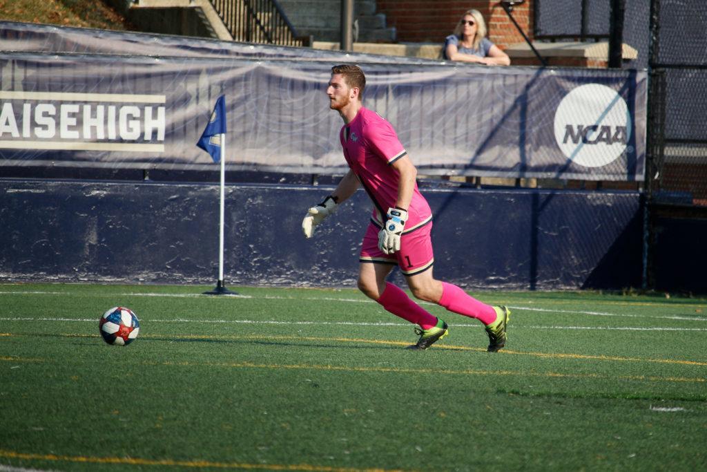 Senior goalkeeper Noah Lubin prepares to kick the ball during Saturdays game against Rhode Island. In a 102-minute battle, the Colonials fell to the Rams 1–0.