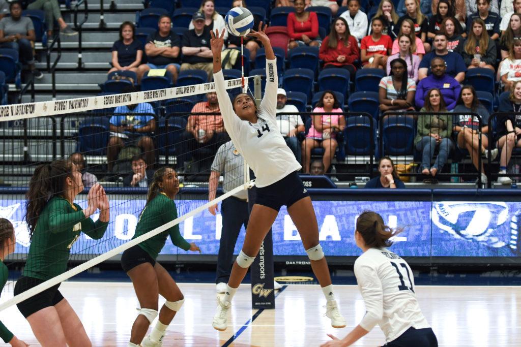Senior setter Jaimeson Lee sets the ball in a game against George Mason. The Colonials beat the Patriots 3–2.