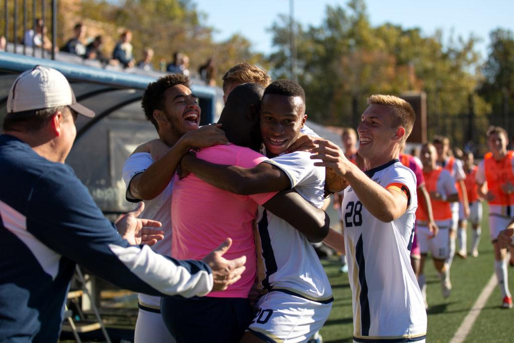 Midfielder+Sophomore+Alhaji+Turay+celebrates+with+his+team+after+scoring+a+goal+in+a+game+against+Saint+Josephs+Wednesday.+The+teams+win+secured+players+a+spot+in+postseason+play.+
