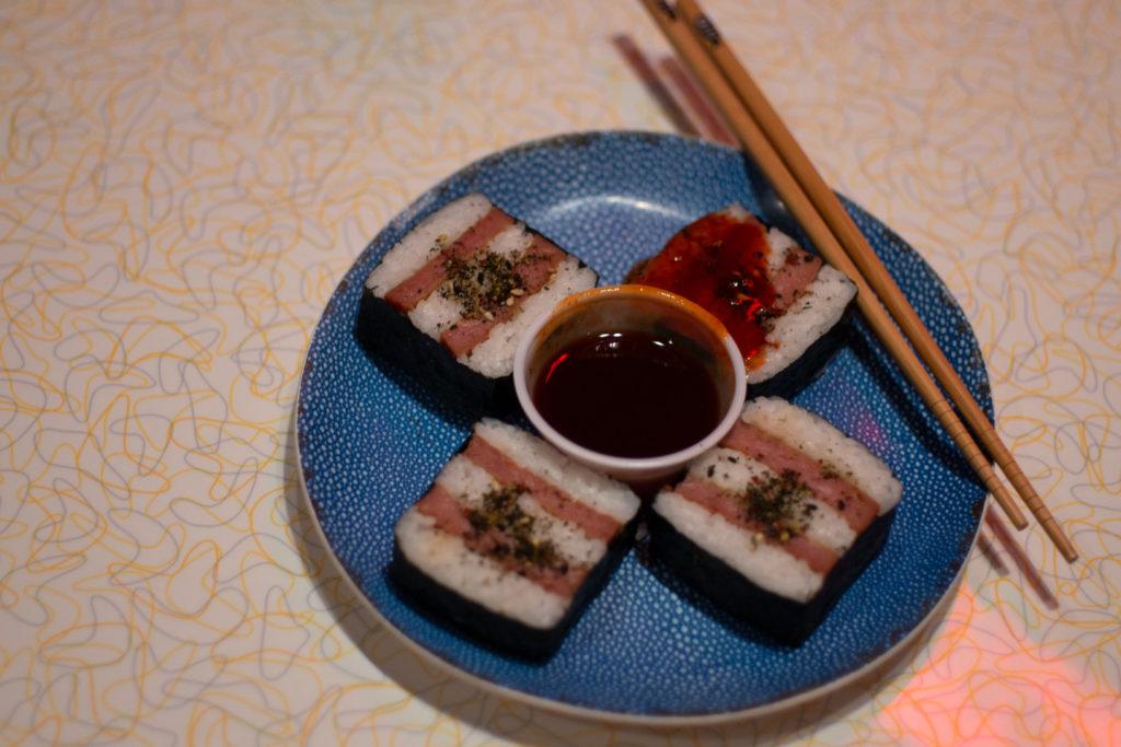 The SPAM musubi at Tiki TNT can be served grilled or fried in a sushi roll with a side of spicy sriracha. 