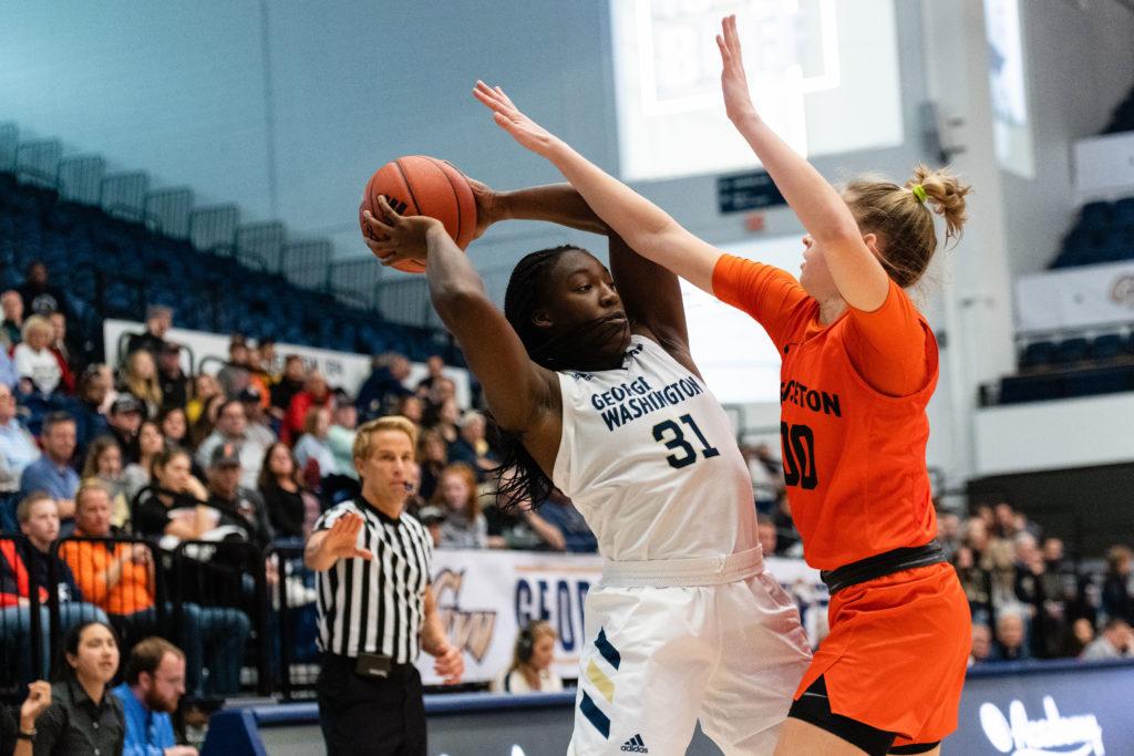 Redshirt Freshman forward Mayowa Taiwo prepares to throw the ball during a game earlier this month. In Sundays game against Memphis, the Colonials beat the Tigers 64–63. 
