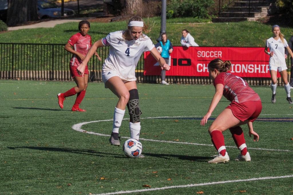 Redshirt senior defender Megan McCormick dribbles the ball during the A-10 quarterfinals against Saint Josephs. The Colonials fell to the Bilikins but still notched its highest A-10 ranking in more than 20 years.