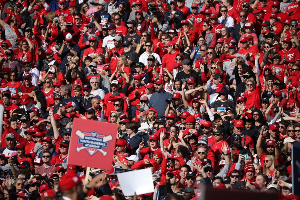Thousands of fans donned red attire to attend the Nationals World Series parade and rally Saturday.