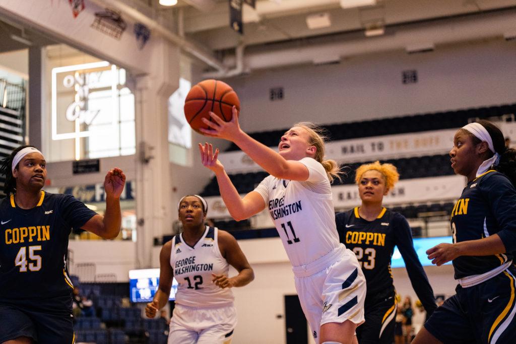 Redshirt freshman guard Tori Hyduke eyes the basket during a game against Delaware Wednesday. The Colonials topped the Blue Hens 63–49. 