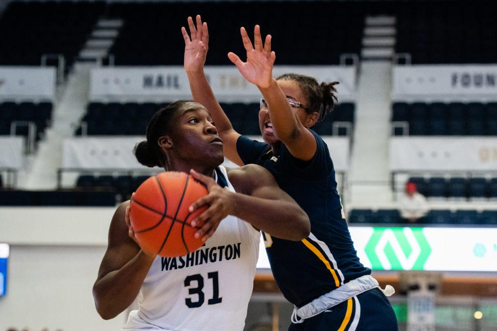 Redshirt freshman Mayowa Taiwo muscles past a defender in a game against Coppin State Dec. 1. Taiwo notched her first career double-double with 11 rebounds and 12 points in a game against Quinnipiac Saturday. 
