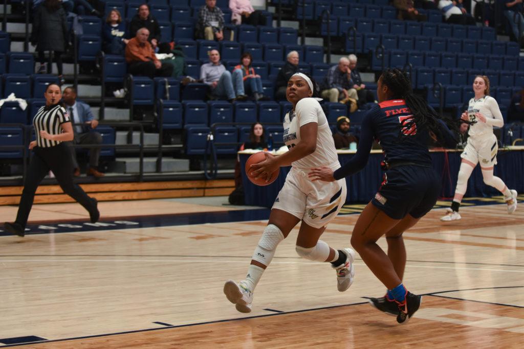 Graduate student forward Alexandra Mound goes for a layup in the Colonials 66–50 loss against Dayton. 