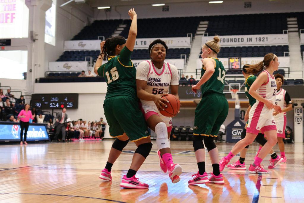 Graduate student forward Alexandra Maund drives toward the basket in a game earlier this month. The Colonials topped Duquesne 72–65 Saturday.  