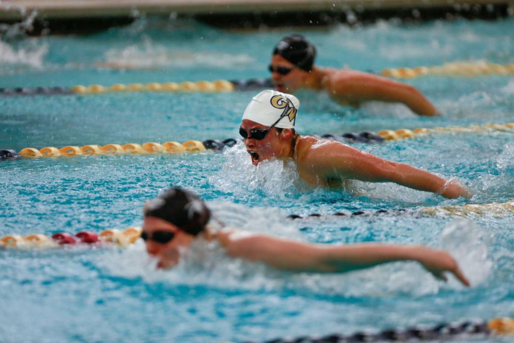 A GW swimmer cuts through the water during a meet in 2020.