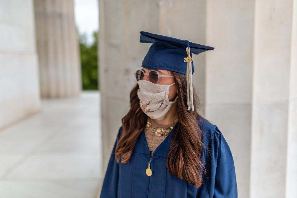Eve Wellish, a graduate from the School of Business, poses for a portrait at the Lincoln Memorial.