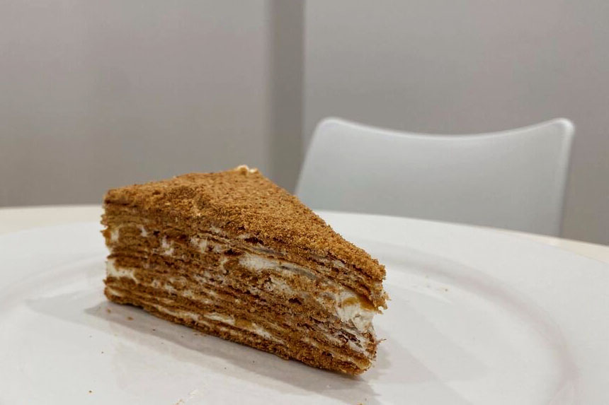 Sharbats medovik, or honey cake, consists of multiple layers of crepe-like pastry stacked atop each other with honey and whipped cream sandwiched in between. 