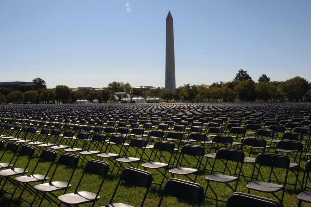 The group Covid Survivors for Change lined up 20,000 empty chairs on the Ellipse outside the White House Saturday to pay tribute to the 200,000 Americans who died from COVID-19.