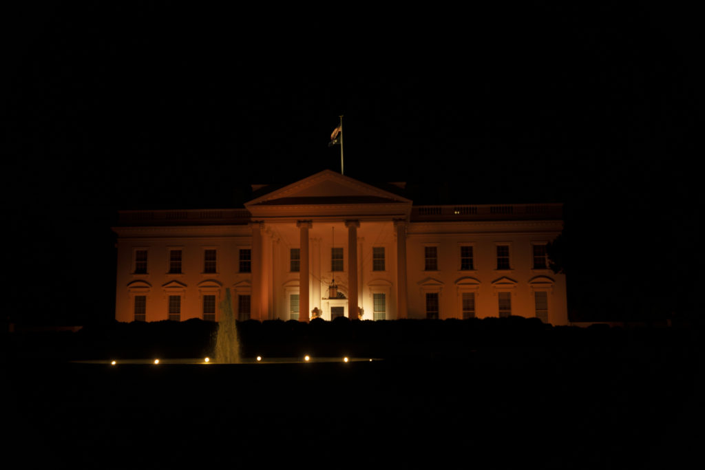 The White House lights up orange to celebrate Halloween this year in place of their annual trick-or-treating event, the first time it has not taken place in the last nine years.