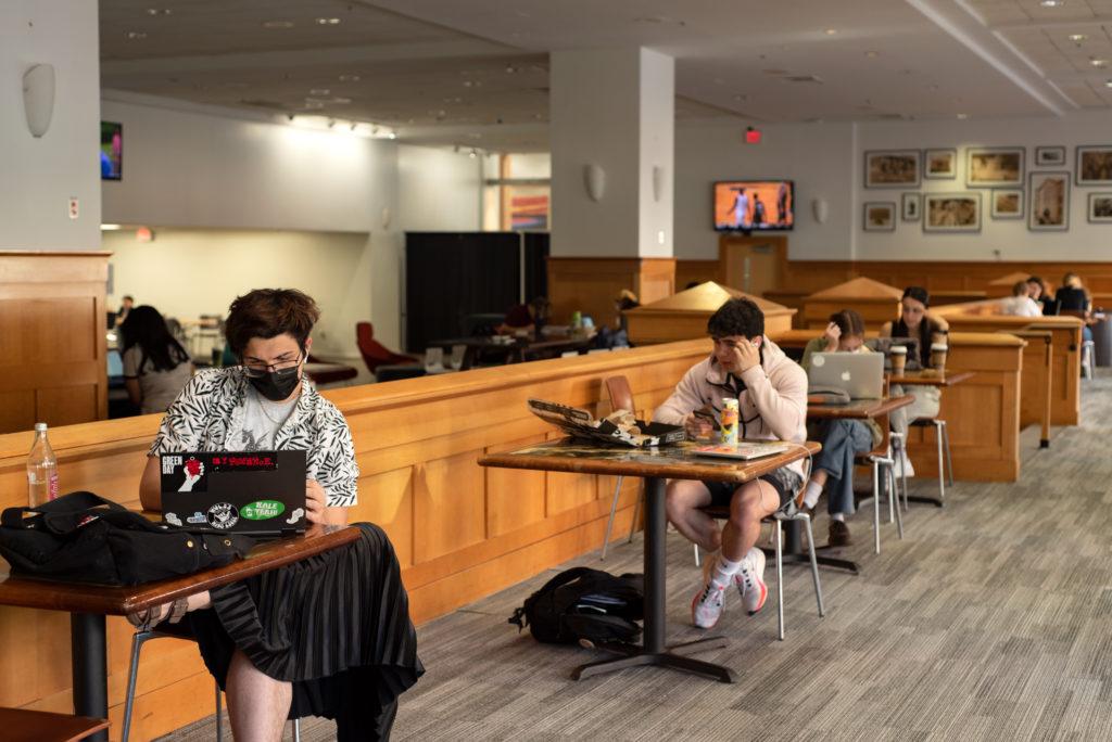 Students in the University Student Center sat masked at tables during the spring 2022 semester, only removing their masks to eat.