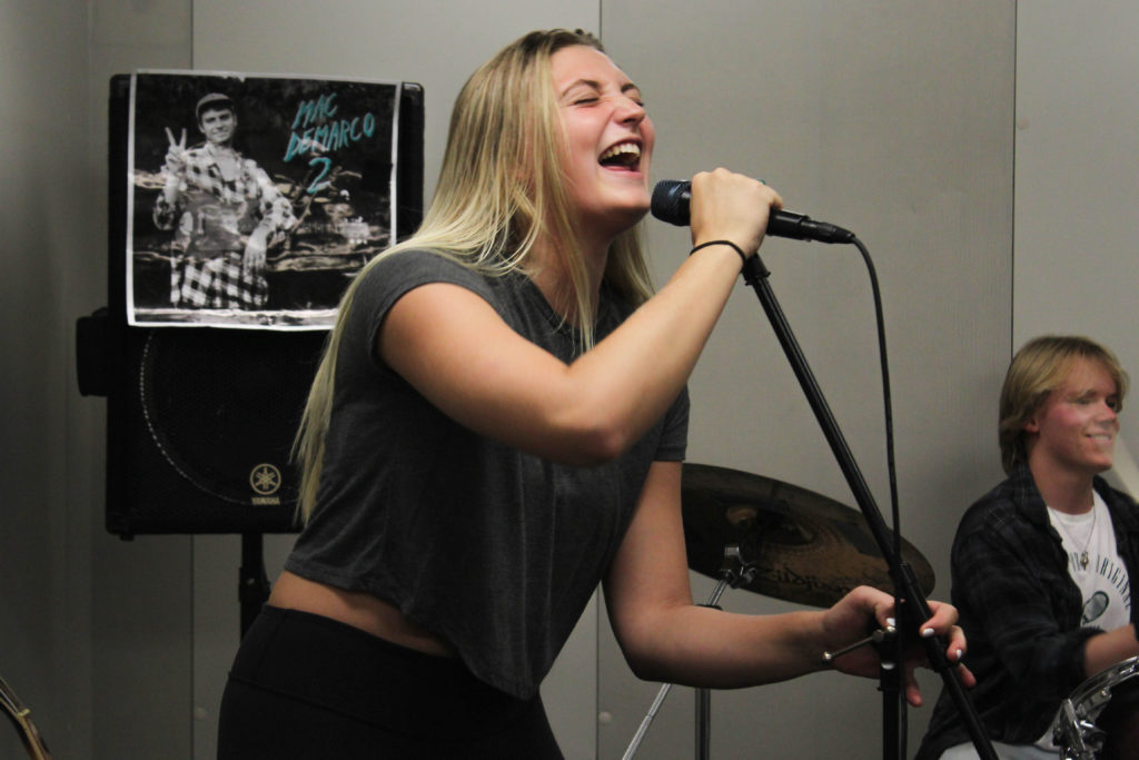 Liza Mozolyuk belts out some notes at an E-19 band practice in the University Student Center Friday.