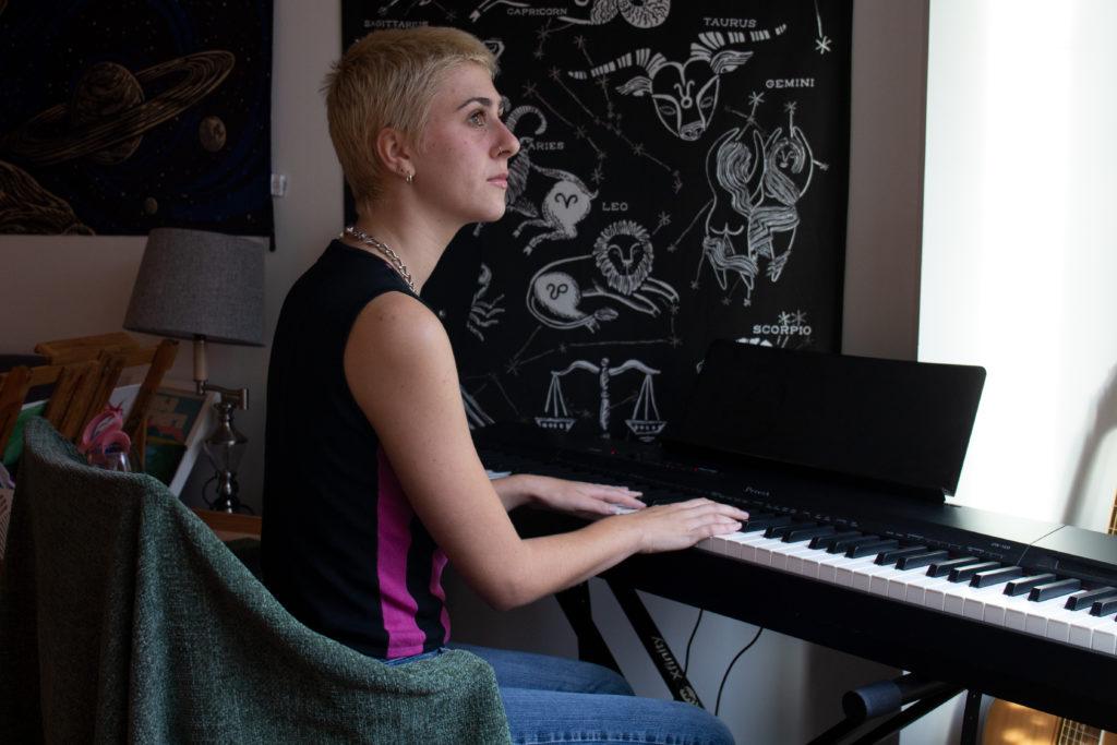 Olivia Graban, a sophomore and singer-songwriter, is photographed in her Shenkman dorm room.