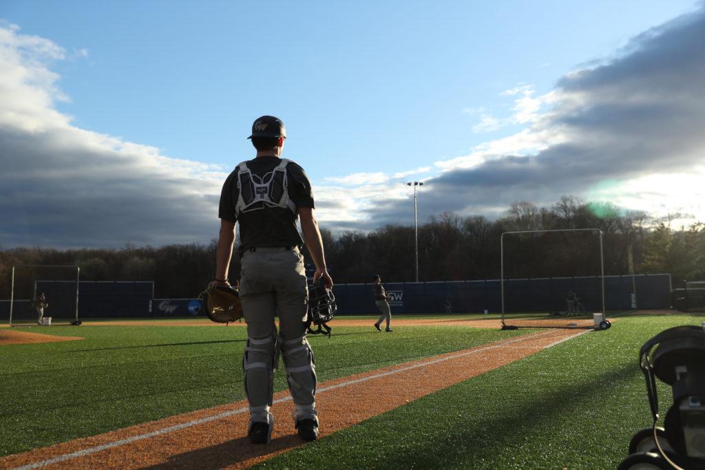 Tim Nicholson, a sophomore catcher from Maryland, takes in the beauty of the baseball diamond during afternoon practice earlier this month.