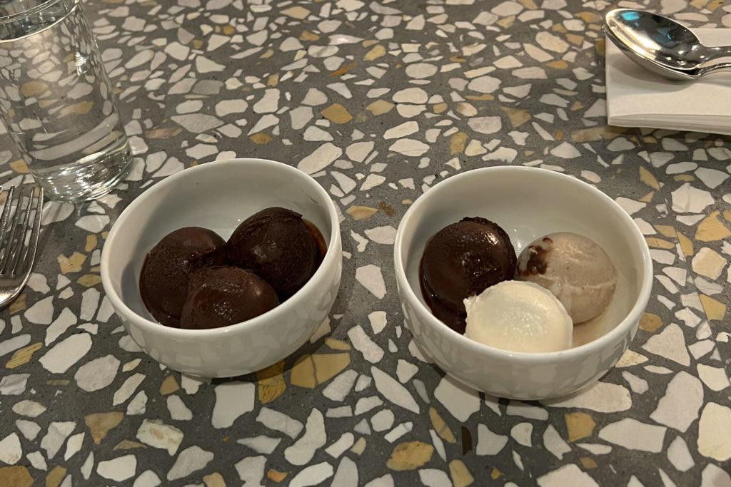 Each dish comes with three scoops, so I opted to mix the tastes with one for each flavor. When first presented, the dessert was split between three oval-shaped rounds of thick cream that were already in the process of melting.