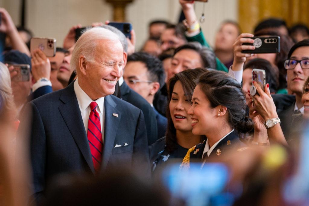 Biden meets guests in the East Room of the White House for a Lunar New Year celebration Thursday. 