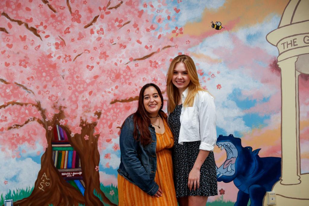 Melanie+Rocha%2C+pictured+left%2C+said+she+and+Jenna+Ahart%2C+right%2C+led+the+painting+sessions+for+the+52-foot+mural.