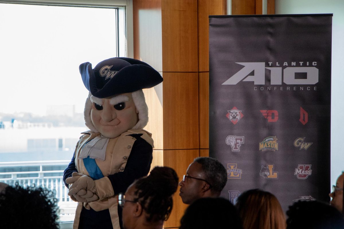 George, the Revolutionaries mascot, slyly smirks during the Atlantic 10 press conference Thursday as officials announced plans to relocate the A-10 headquarters to Washington, D.C.