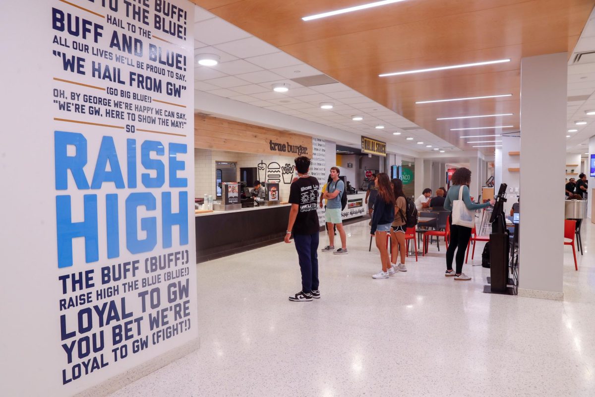 Students await orders from food vendors in District Halls food court, which inflated its prices this semester.