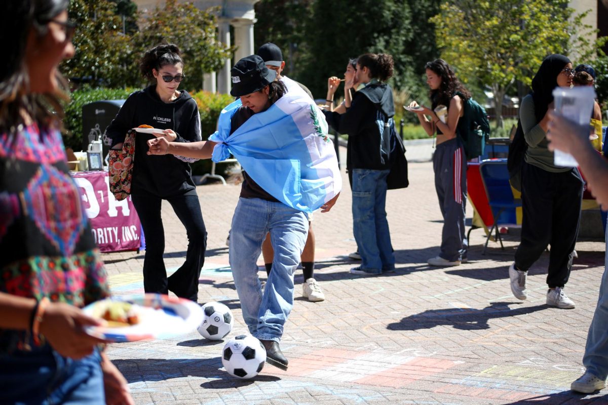 Students toed soccer balls across the bricks of Kogan Plaza last week during the Organization of Latin American Students kick-off for Hispanic Heritage Month. 