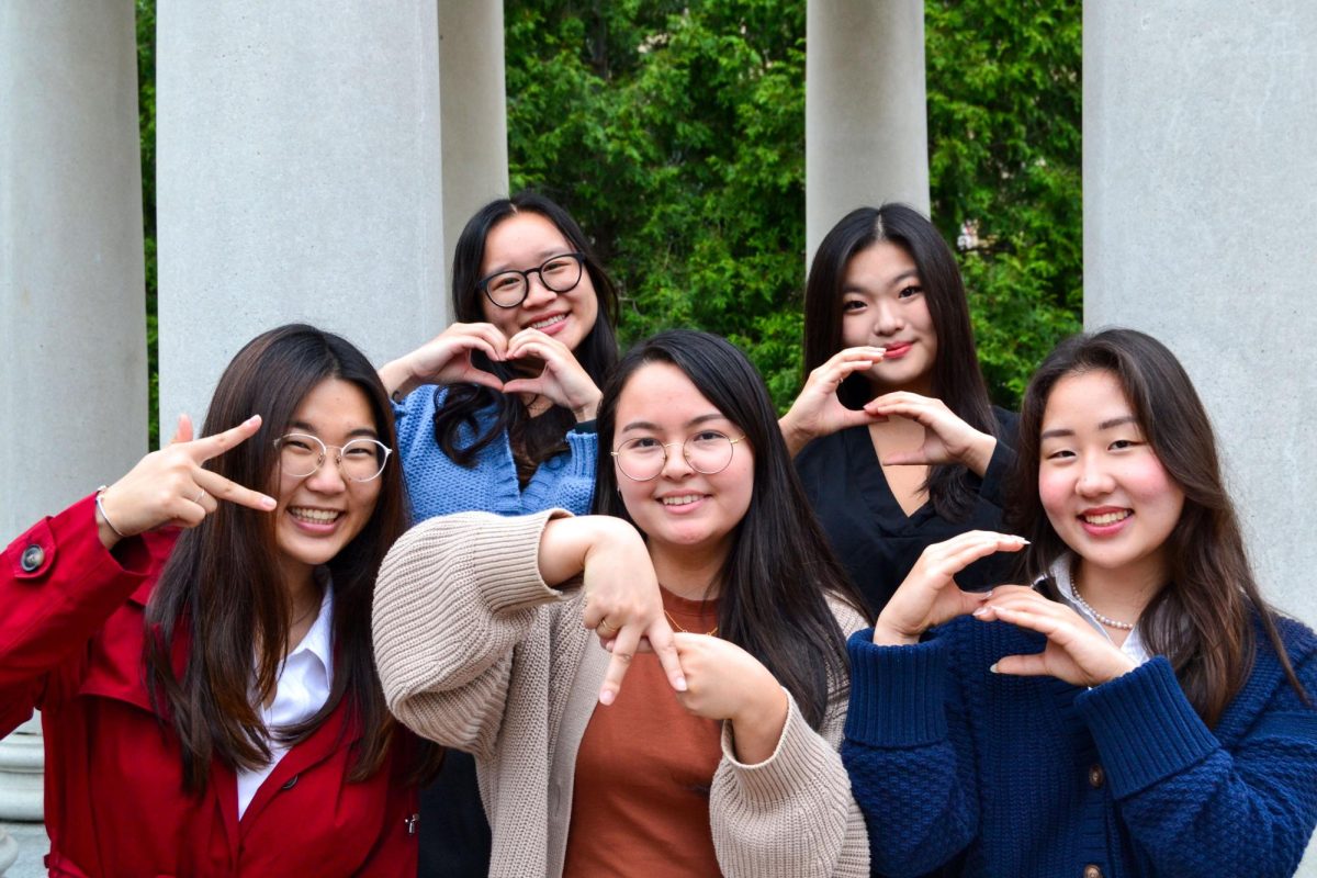 Executive board members of the GW Korean American Student Society pose with the KASS initials in Kogan Plaza.