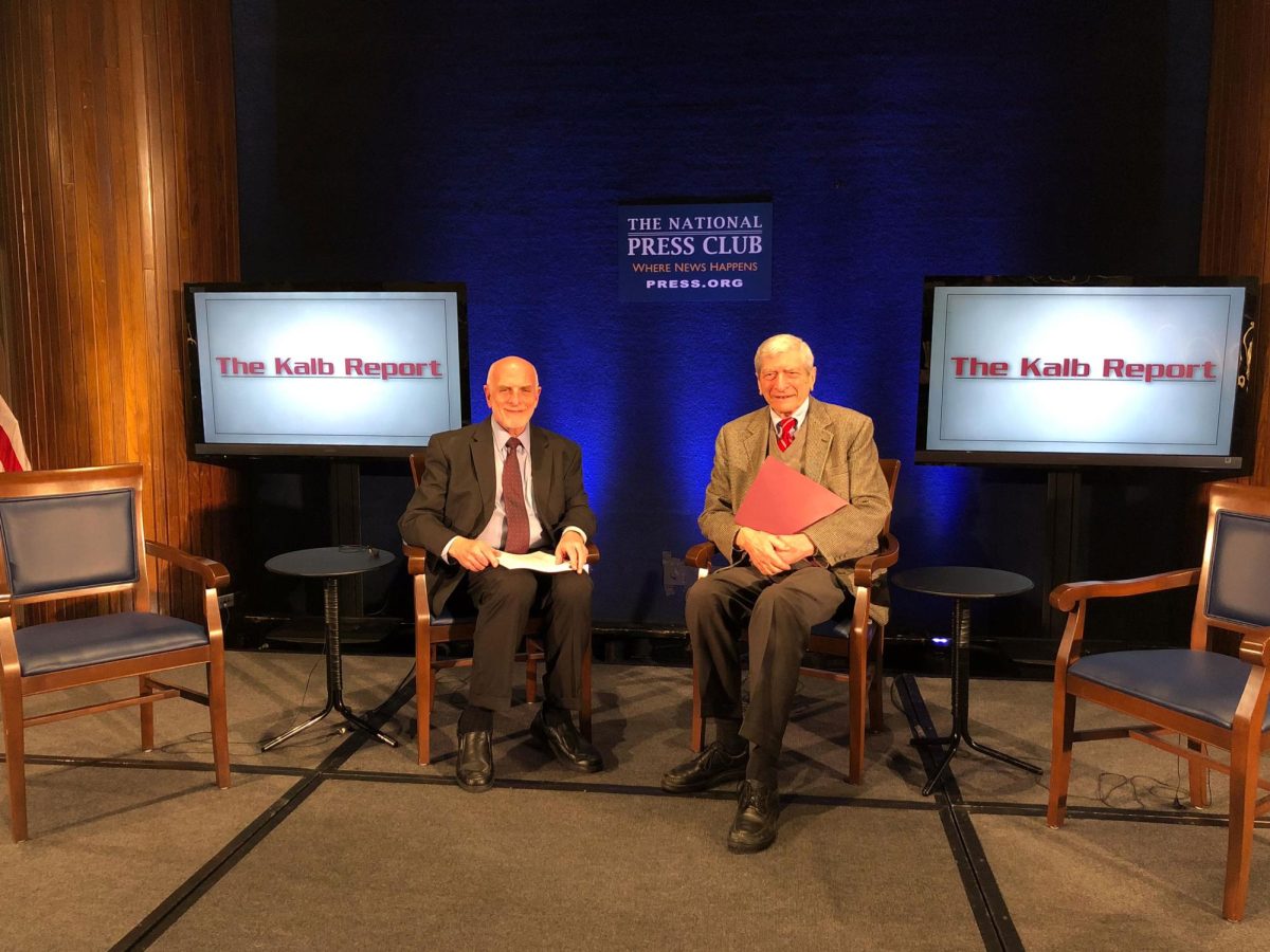 Michael Freedman (left) sits alongside former CBS and NBC chief diplomatic correspondent Marvin Kalb (right) at a National Press Club event. 