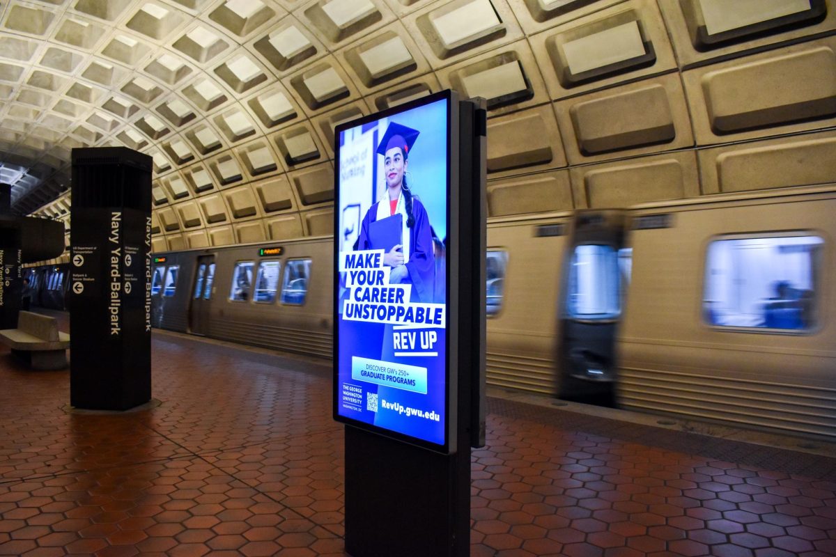 A University advertisement flashes onto a screen in the Navy Yard-Ballpark Metro station, calling on commuters to “Rev Up.”