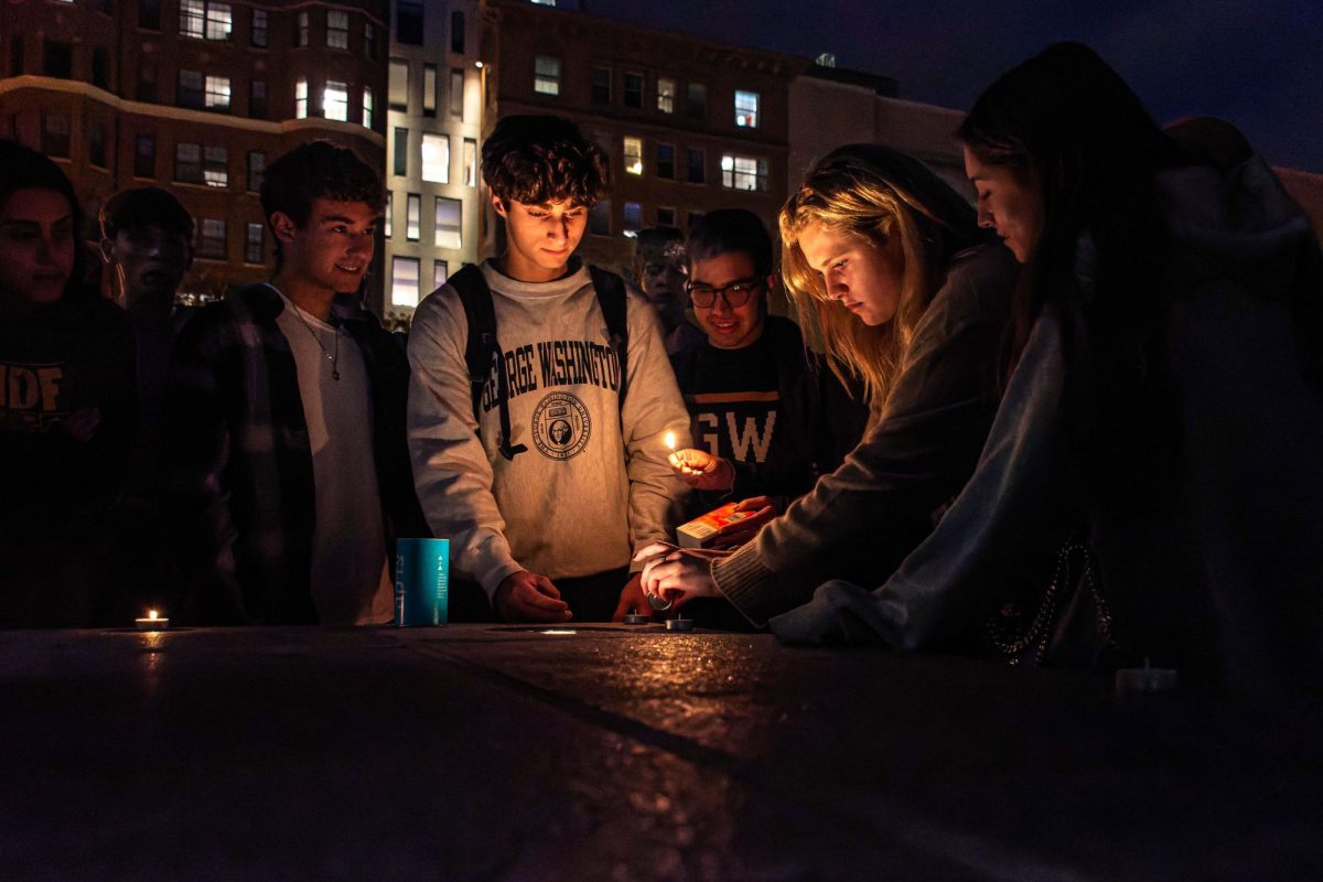 Students+light+candles+in+remembrance+of+the+Israeli+lives+lost+to+the+Israel-Hamas+war+during+a+GW+for+Israel+vigil+in+Kogan+Plaza+earlier+this+month.