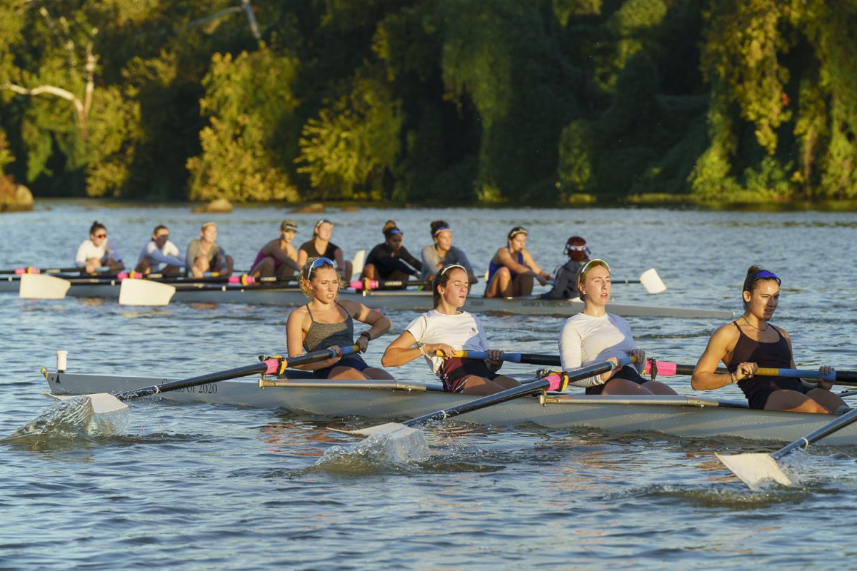 The women's rowing team cuts through the Potomac River during a practice this semester.  