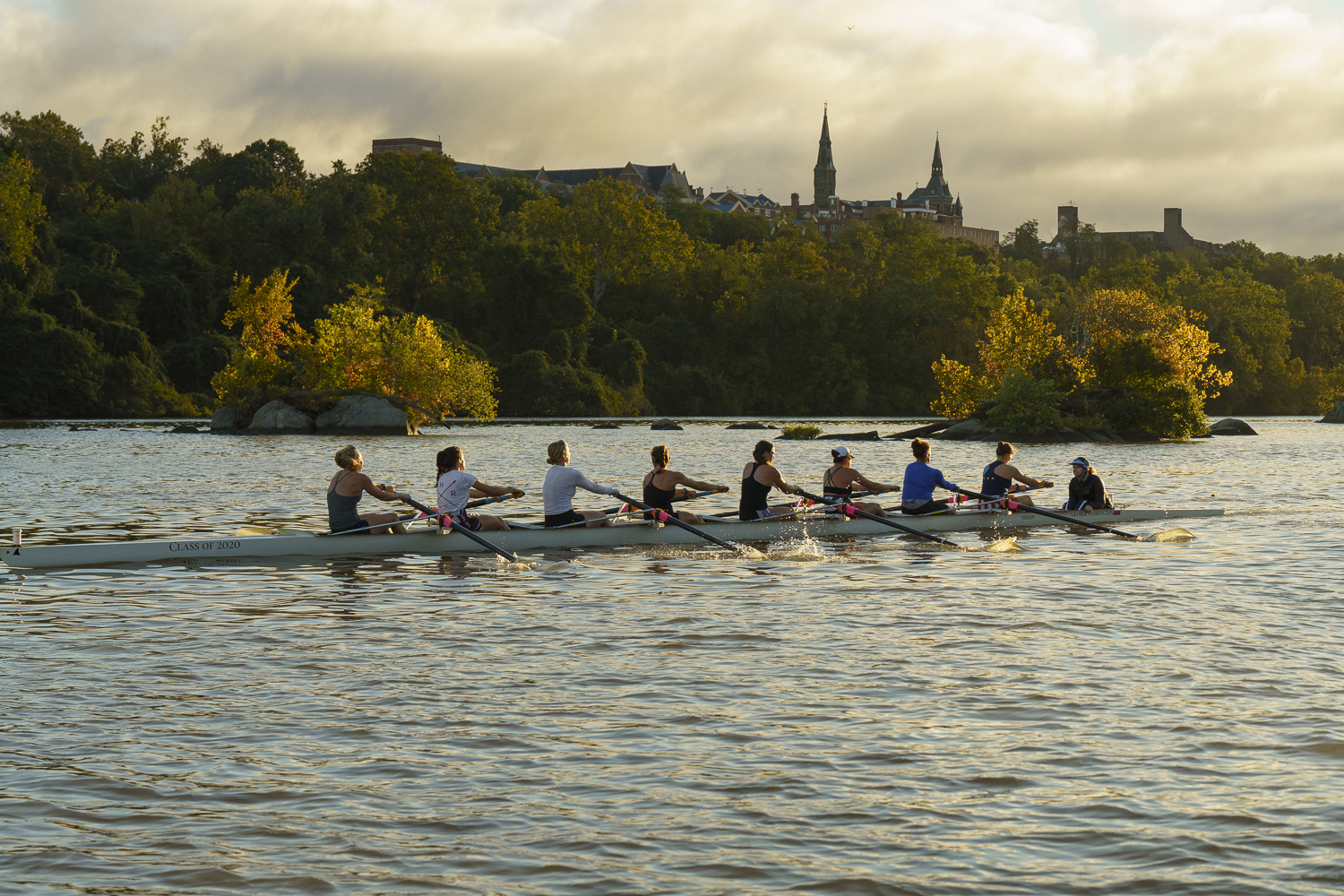The GW womens rowing team embarks on an early morning practice down the Potomac River.