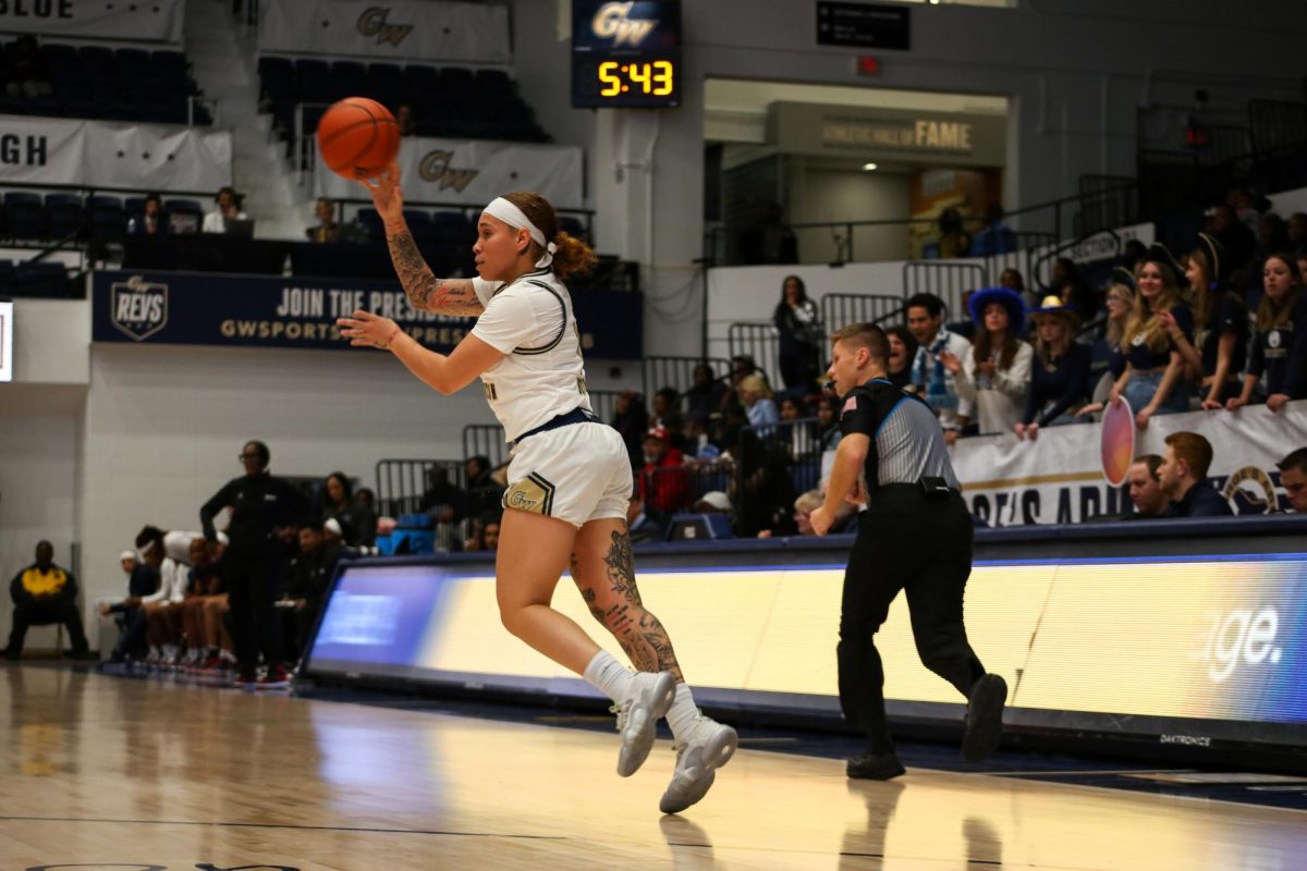 Graduate student guard Madison Buford pushes the ball up court. 